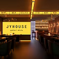 Cozy Bar Interior With Yellow House Sign Warm Lights And Friends Gathering Tables