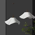 Modern Pendant Lights Hanging With White Wavy Shades Gold Fixtures Gray Wall And Green Plant