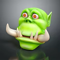 Fierce Green Goblin Monster Head With Red Eyes Pointed Ears And Large Tusks