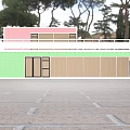 Two Story Container Building With Pink Green Exterior Balcony And Staircase