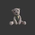 Gray Plush Teddy Bear Doll Wearing Green Scarf Sitting Against Gray Background