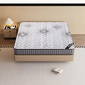 Comfortable Mattress With Patterned Surface On Bed Base Near Nightstand And Table Lamp