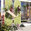 Outdoor Floral Decorative Scene With Green Arch Circular Ornaments And Colorful Flowers