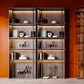 Shelving Units With Red Background Grid Design Tea Sets Books Decorative Items And Green Plant