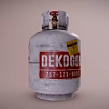 Silver Gray LPG Cylinder With Red Valve And Warning Label On Metal Surface
