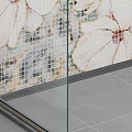 Modern Bathroom With Glass Shower Partition Gray Tiled Floor White Toilet And Floral Mosaic Wall