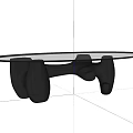 Modern Coffee Table Featuring Glass Top and Unique Black Sculptural Base