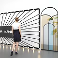 Contemporary Art Installation With Radial Lines Central Text Arched Frames Green Plants And Standing Woman
