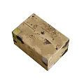 Brown Cardboard Box With Black Stains And White Labels On Soiled Surface