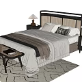 Double Bed With Bedside Tables Table Lamps Blanket Bench And Patterned Rug