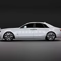White Rolls Royce Luxury Sedan With Modern Design Front Grille And Alloy Wheels