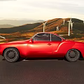 Red Vintage Car Driving On Road With Mountains Green Fields Wind Turbines And Sunset Sky