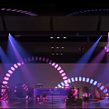 Elegant Banquet Hall with Colorful Stage Lighting and Arched Decorative Elements