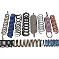 Assorted Metal Springs In Various Colors And Different Coil Shapes