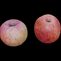 Two Fresh Ripe Red and Yellow Striped Apples on Black Background Healthy Snack