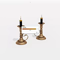 Ornate Metal Candlesticks With Lit Black Candles And Carved Handles Design