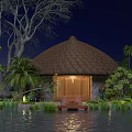 Rustic Thatched Roof Homestay Building with Warm Lighting Surrounded by Greenery and Water at Night