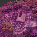 Ancient Ruins Site Surrounded by Lush Green Vegetation and Trees