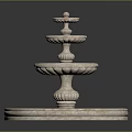 Three Tier Decorative Stone Fountain With Circular Base And Ornate Design