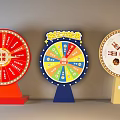 Lucky Draw Spinning Wheels With Red Colorful Beige Bases Featuring Prize Drinks And Snacks