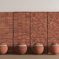 Four Decorative Terracotta Spheres Placed Against Red Brick Wall Backdrop 3d model