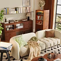 Beige Curved Sofa With Green Brown Cushions And Wooden Round Coffee Table On Geometric Rug