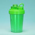 Green Sports Water Bottle with Straw and Flip Lid on Light Blue Background