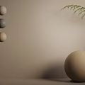 Beige Wall Decor Featuring Three Small Spheres Large Sphere and Fern Leaves