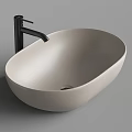 Modern Cream Colored Oval Countertop Wash Basin With Black Faucet Design