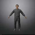 Man in Gray Hoodie and Gray Pants Standing with Arms Outstretched on Gray Background