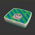 Square Device With Blue Green Striped Pattern And Circular Control Panel