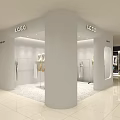 Modern Clothing Store Interior With White Mannequins Chandelier and Green Plant