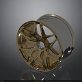 Shiny Gold Automotive Wheel Rim With Multi Spoke Design And Chrome Accents