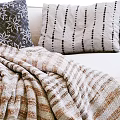 Cozy Modern Living Room Multi Seater Sofa With Striped Blanket And Patterned Pillows