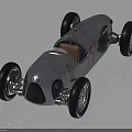 Audi Vintage Race Car With Silver Streamlined Body And Brown Leather Seat