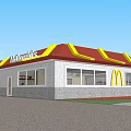 Commercial Complex Featuring McDonald's Restaurant With Red Roof Yellow Signage White Fence And Red Umbrellas