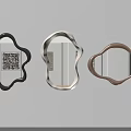 Three Abstract Shaped Decorative Mirrors in Black Beige and Brown Hanging on White Wall
