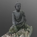Stone Carved Buddha Sculpture In Sitting Posture With Moss And Fallen Leaves