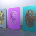 Colorful Decorative Ornament Set With Fingerprint Design In Yellow Purple Teal On Wooden Surface