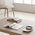 Open Magazines And Stacked Books On Wooden Coffee Table In Minimalist Living Room