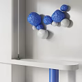 Blue And White Spherical Balls Wall Decor On White Wall With Shelf 3d model