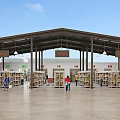 Spacious Open Market Interior With Rows Of Shelves Hanging Signs And People Shopping