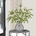 Clear Glass Vase With White Flowers Green Foliage On Patterned Table Near Window Snowy Pines