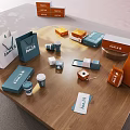 Decorative Ornament Set on Wooden Table with Jamib Brand Boxes Cups and Cards