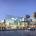 Modern Commercial Street With Glass Facade Buildings Pedestrians Vehicles And Tall Skyscrapers Under Evening Sky