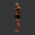 A Muscular Man With Arms Outstretched Wearing Black Shorts And Red Sneakers