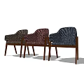 Three Accent Chairs With Zebra Pattern In Different Colors And Wooden Legs