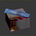 Delicious Chocolate Bar With White Wrapper And Red Gold Accents Placed On Textured Silver Box