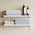 White Two Tier Bathroom Shelf With Light Blue And Beige Folded Towels And Bath Products