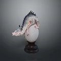 Detailed Dragon Sculpture With Scales Perched On White Egg Wooden Pedestal